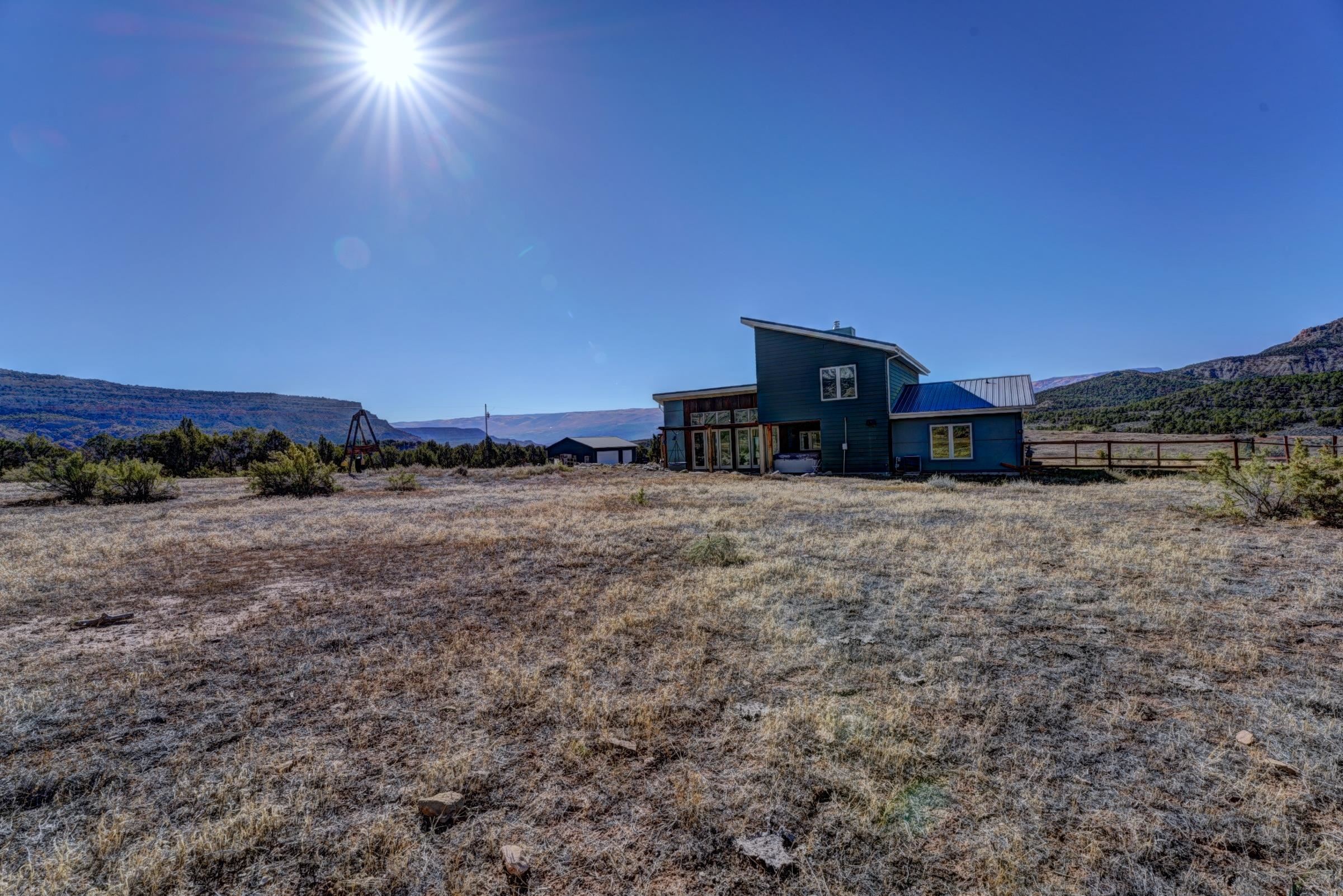 1570-45 45 1/2 Road De Beque, CO 81630 - Photo 34 of 35 a view of a house with a yard