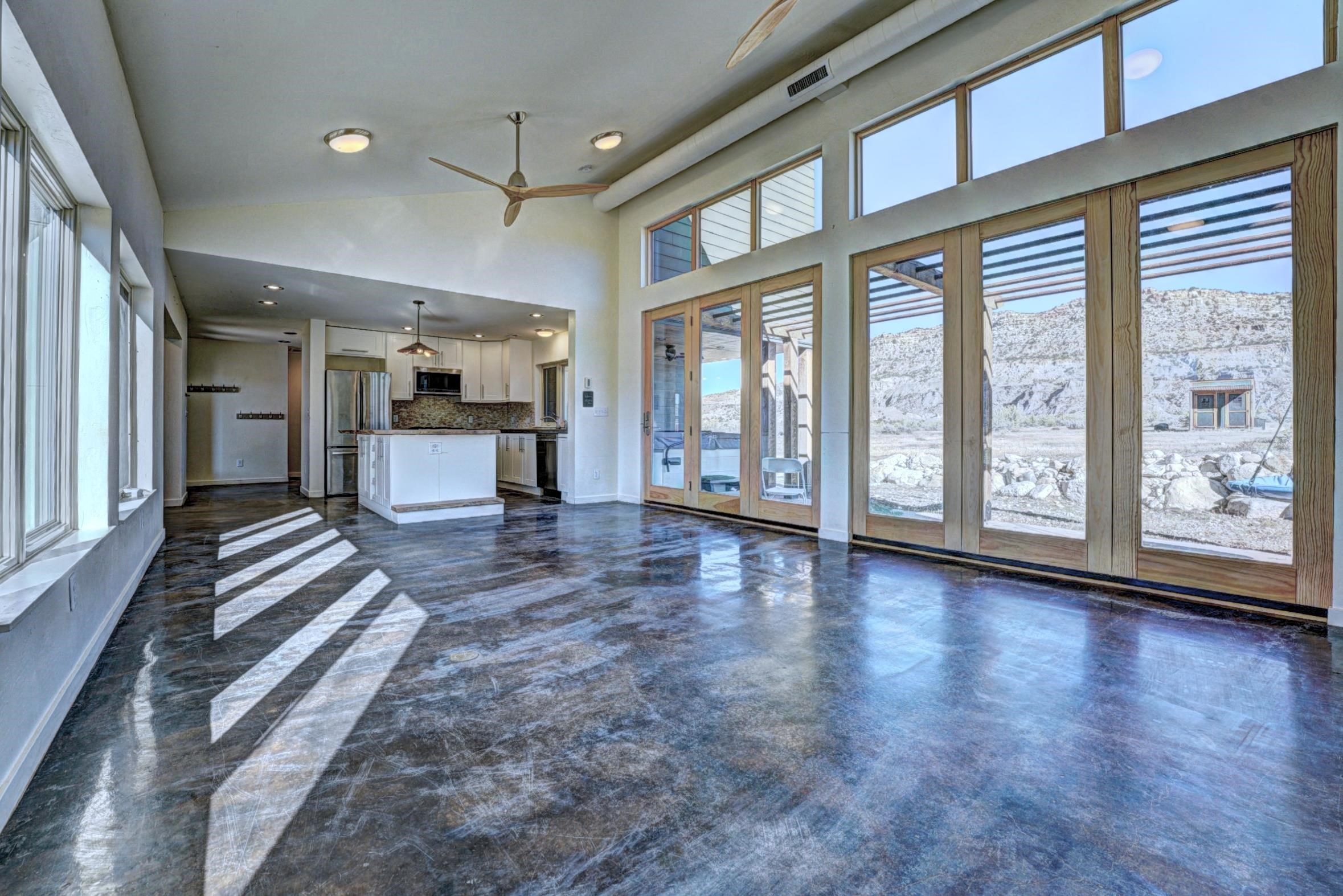 1570-45 45 1/2 Road De Beque, CO 81630 - Photo 4 of 35 a view of a large room with wooden floor and windows
