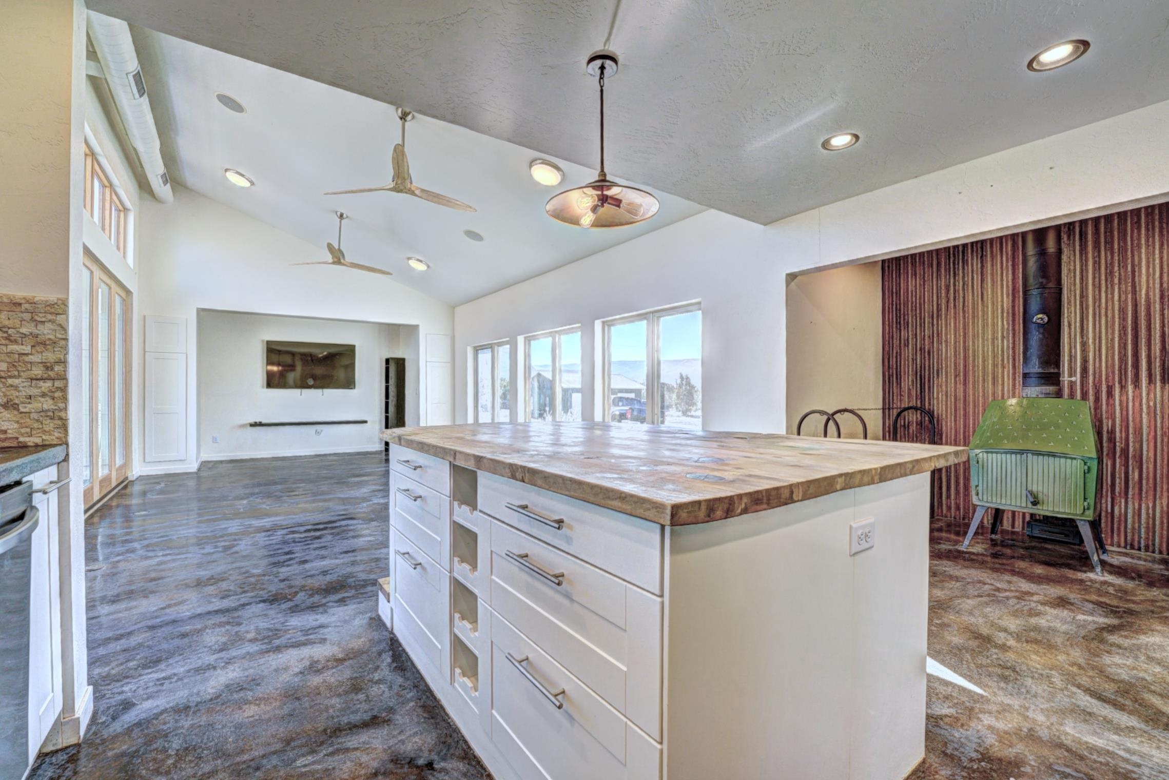 1570-45 45 1/2 Road De Beque, CO 81630 - Photo 8 of 35 a kitchen with a stove and a large window
