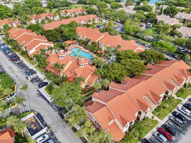 an aerial view of residential houses with outdoor space