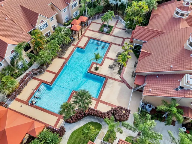 an aerial view of house with a yard