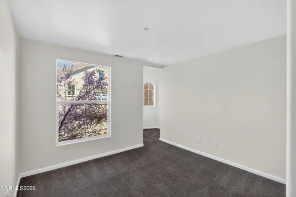 a front view of a house with two windows