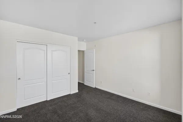 a bathroom with a tub a sink and mirror