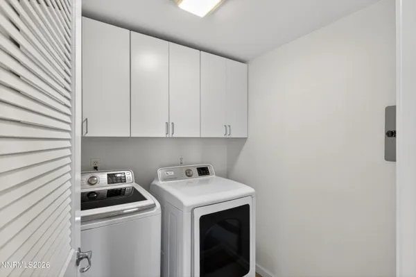 a view of an empty room with a fan