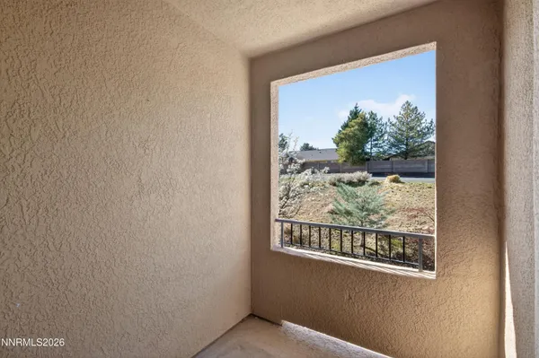 a bathroom with a granite countertop sink a large mirror and shower