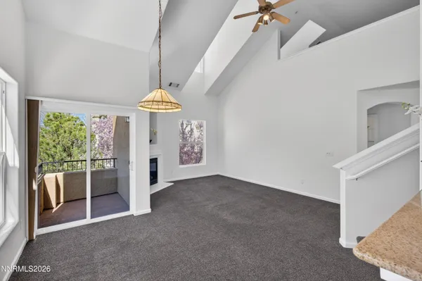 a view of a room with furniture and windows