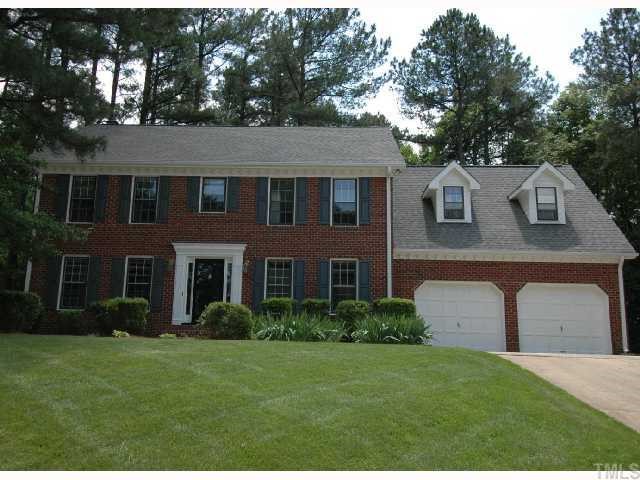 8304 Mourning Dove Road Raleigh, NC 27615 - Photo 1 of 8 a front view of a house with a yard and trees