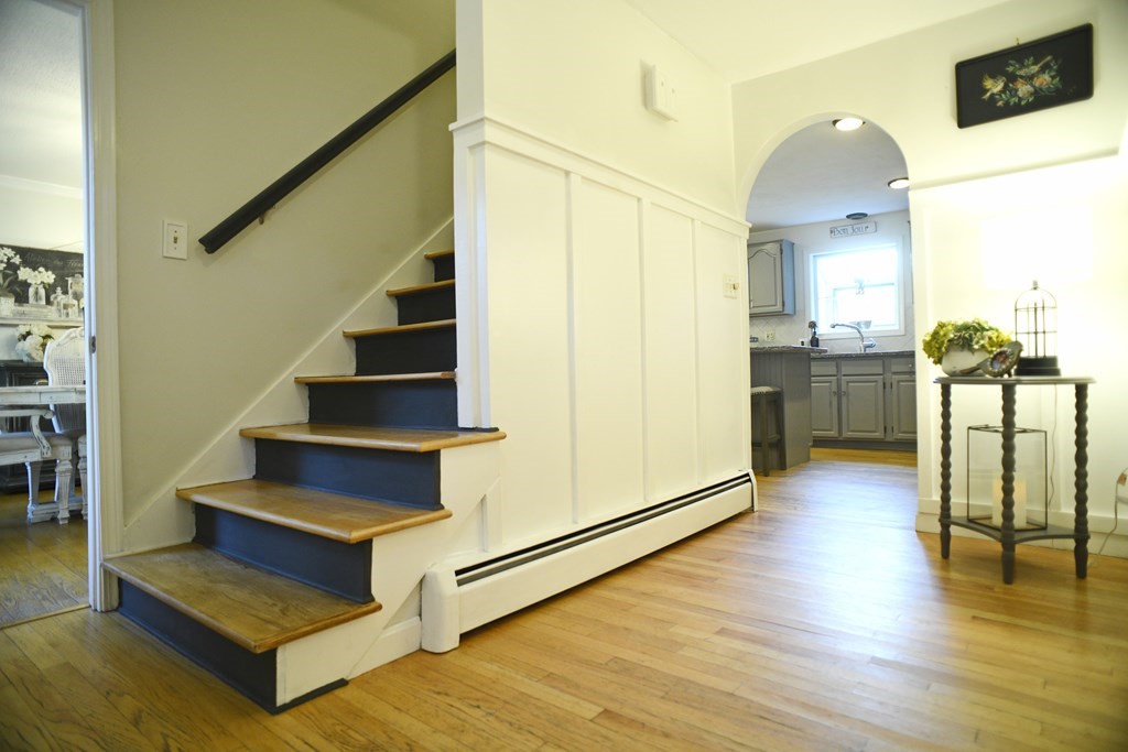 72 Heritage Drive Lowell, MA 01852 - Photo 13 of 29 a view of a living room with furniture and wooden floor