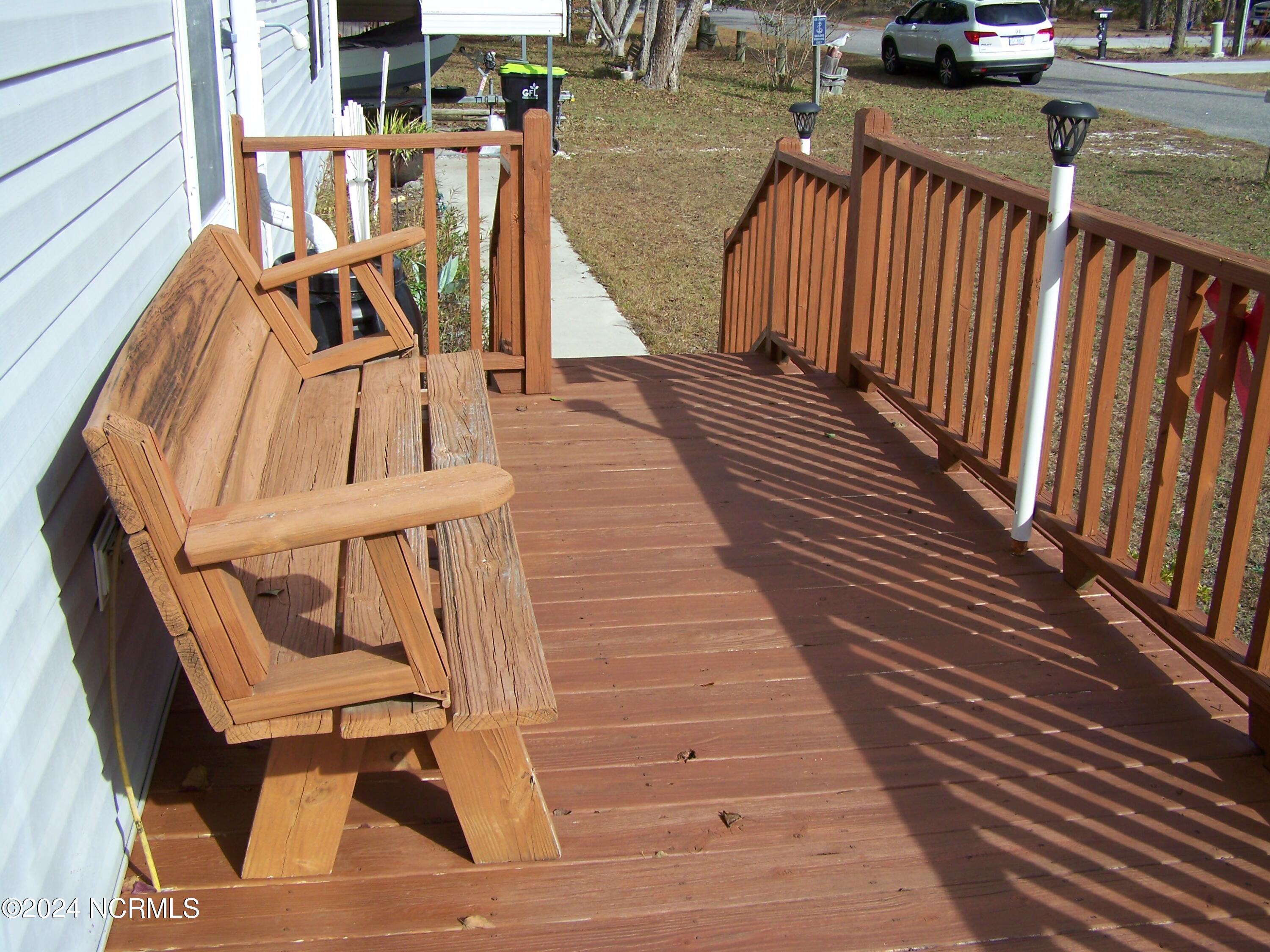 36 North Lake Drive Boiling Spring Lakes, NC 28461 - Photo 10 of 55 Right side deck with bench