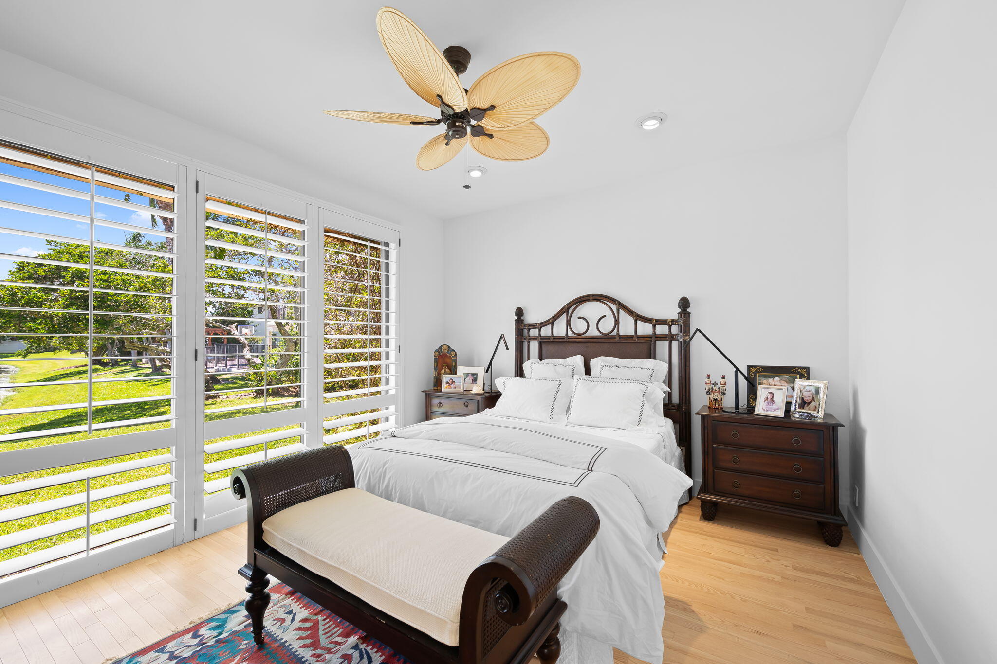 4885 Regency Court Boca Raton, FL 33434 - Photo 15 of 38 a bedroom with a bed and a large window