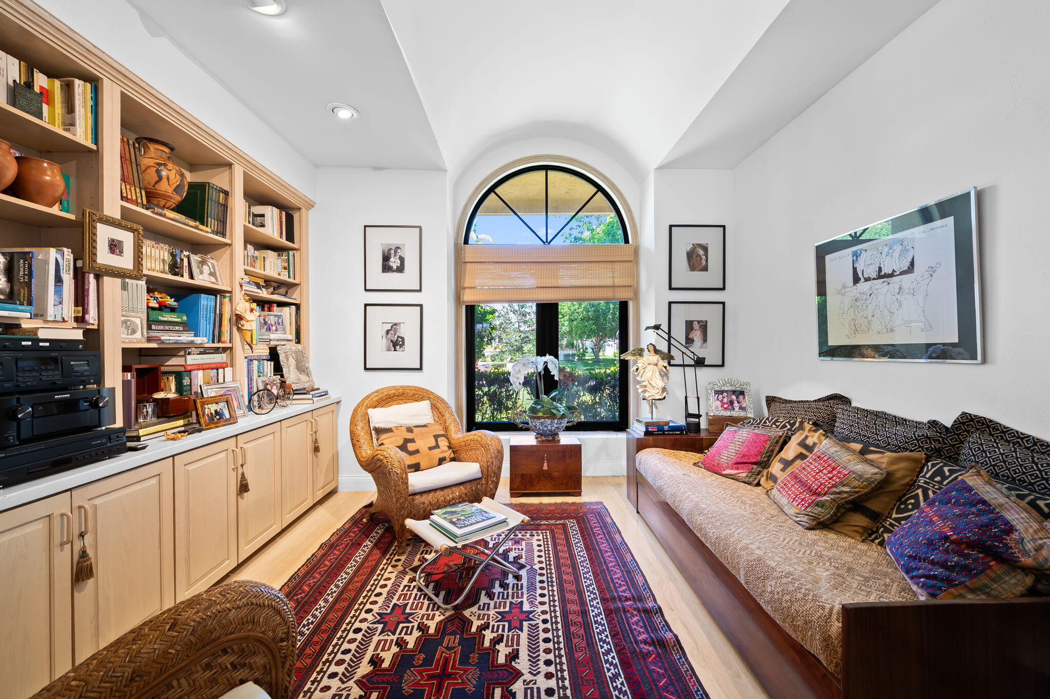 4885 Regency Court Boca Raton, FL 33434 - Photo 23 of 38 a living room with furniture and a book shelf