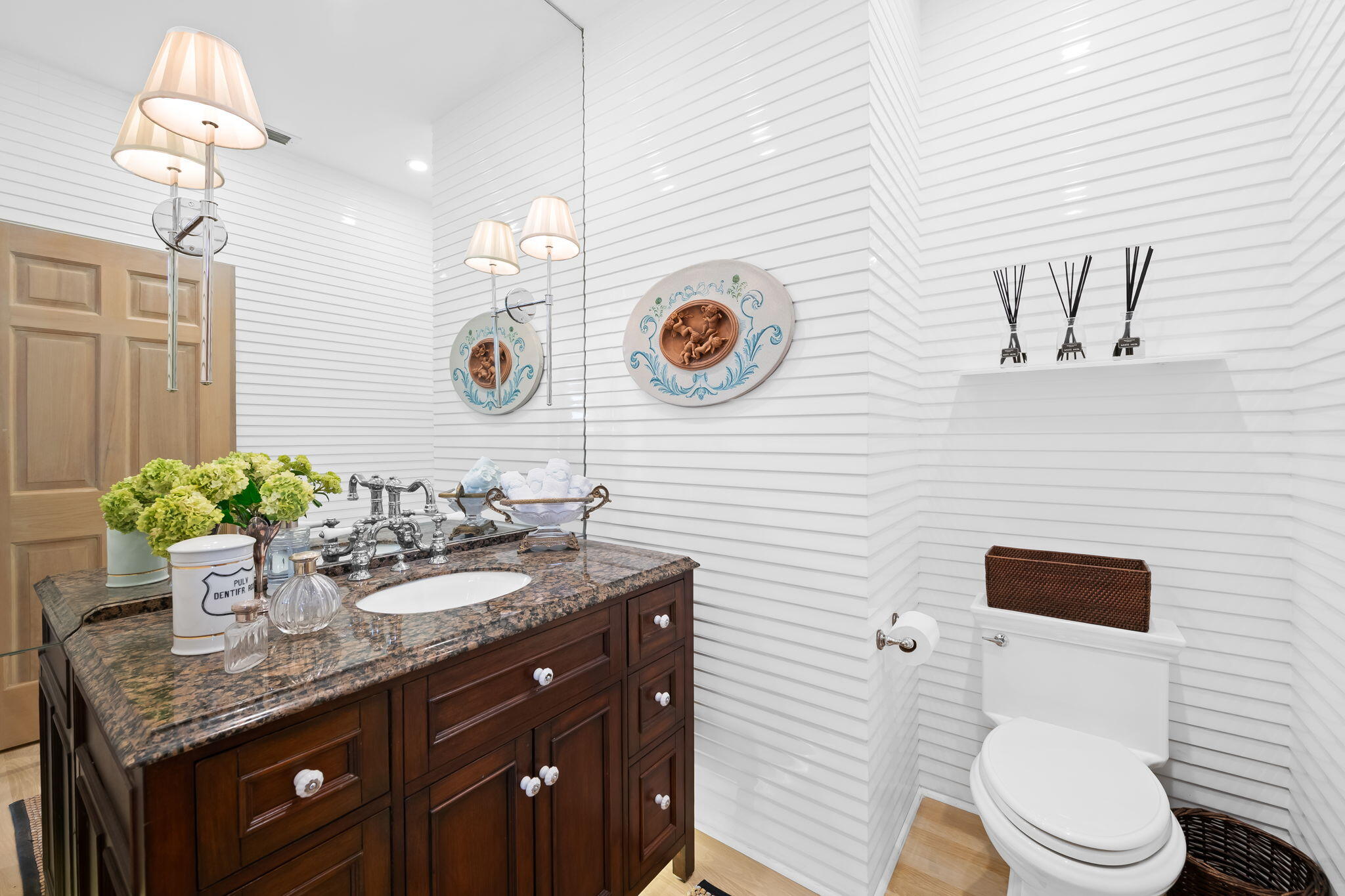 4885 Regency Court Boca Raton, FL 33434 - Photo 24 of 38 a bathroom with a granite countertop sink a toilet and mirror