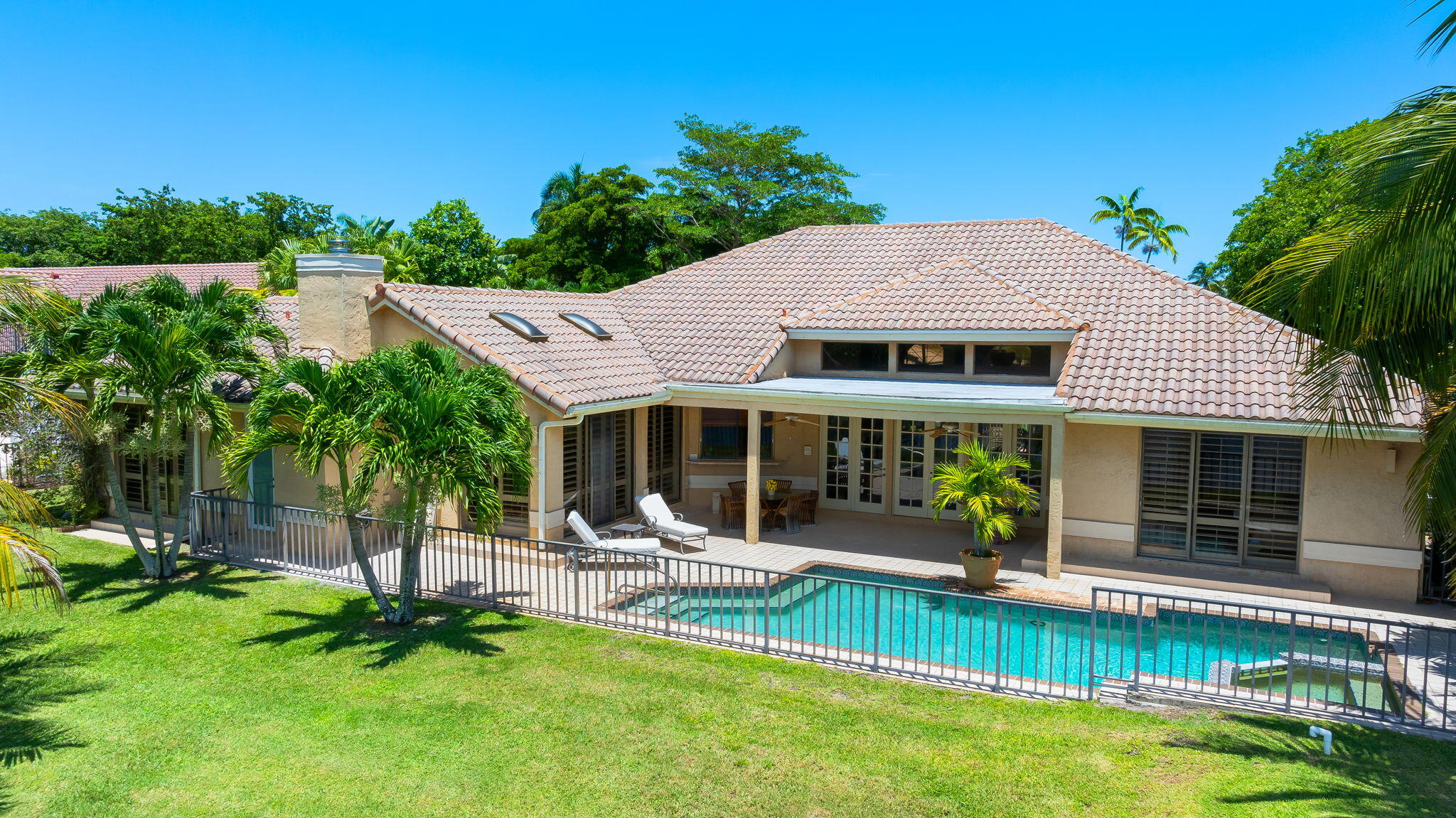 4885 Regency Court Boca Raton, FL 33434 - Photo 26 of 38 a view of a house with a yard patio and a patio