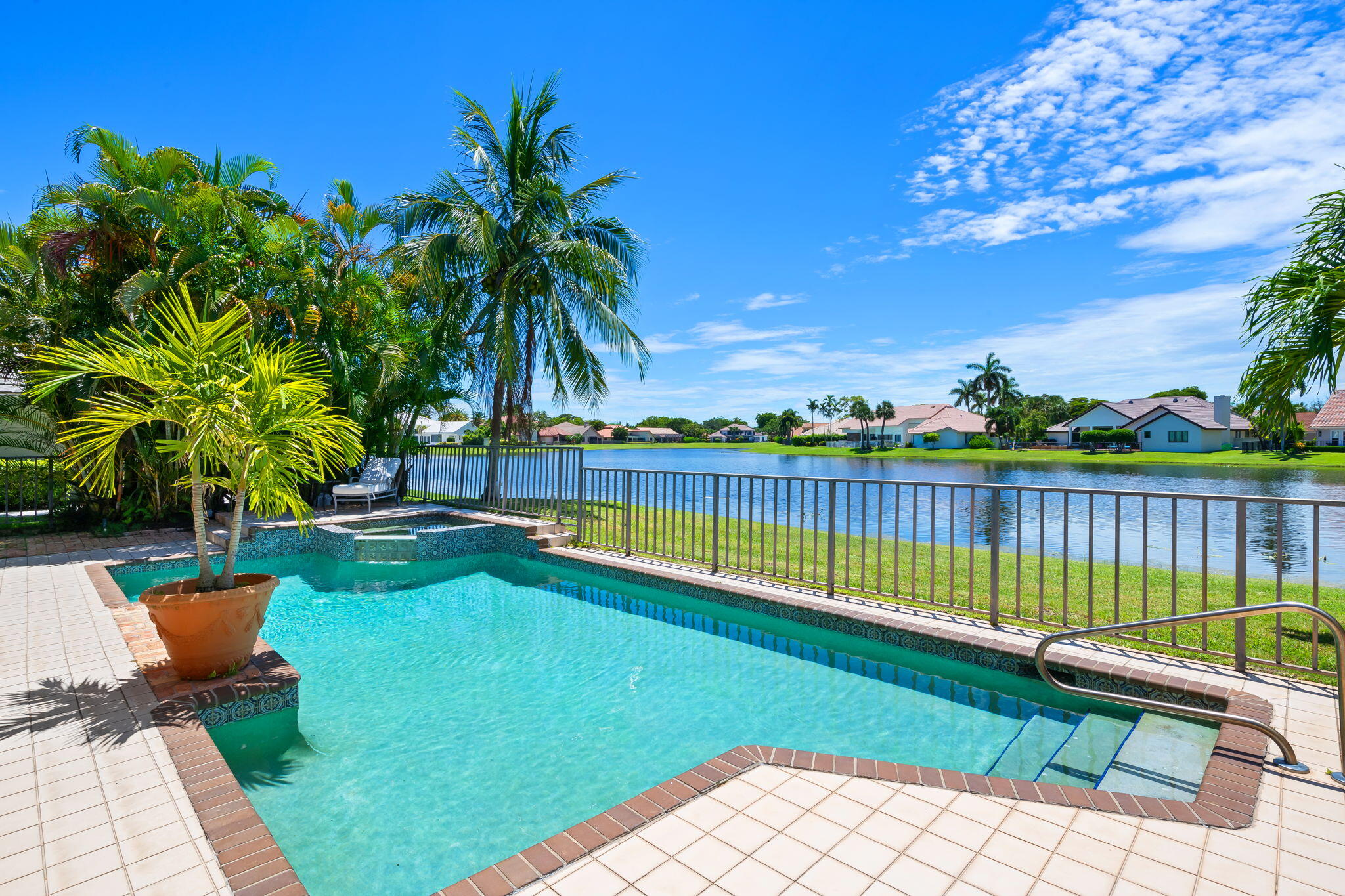 4885 Regency Court Boca Raton, FL 33434 - Photo 30 of 38 a view of swimming pool with a lounge chair