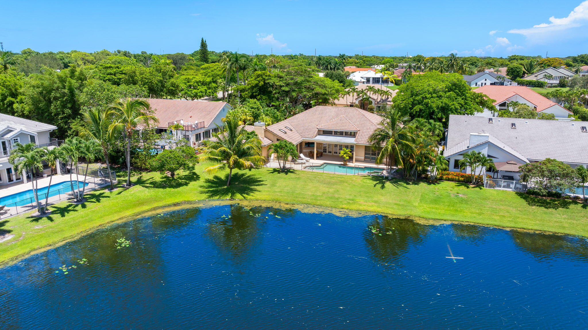 4885 Regency Court Boca Raton, FL 33434 - Photo 32 of 38 an aerial view of residential houses with outdoor space and swimming pool