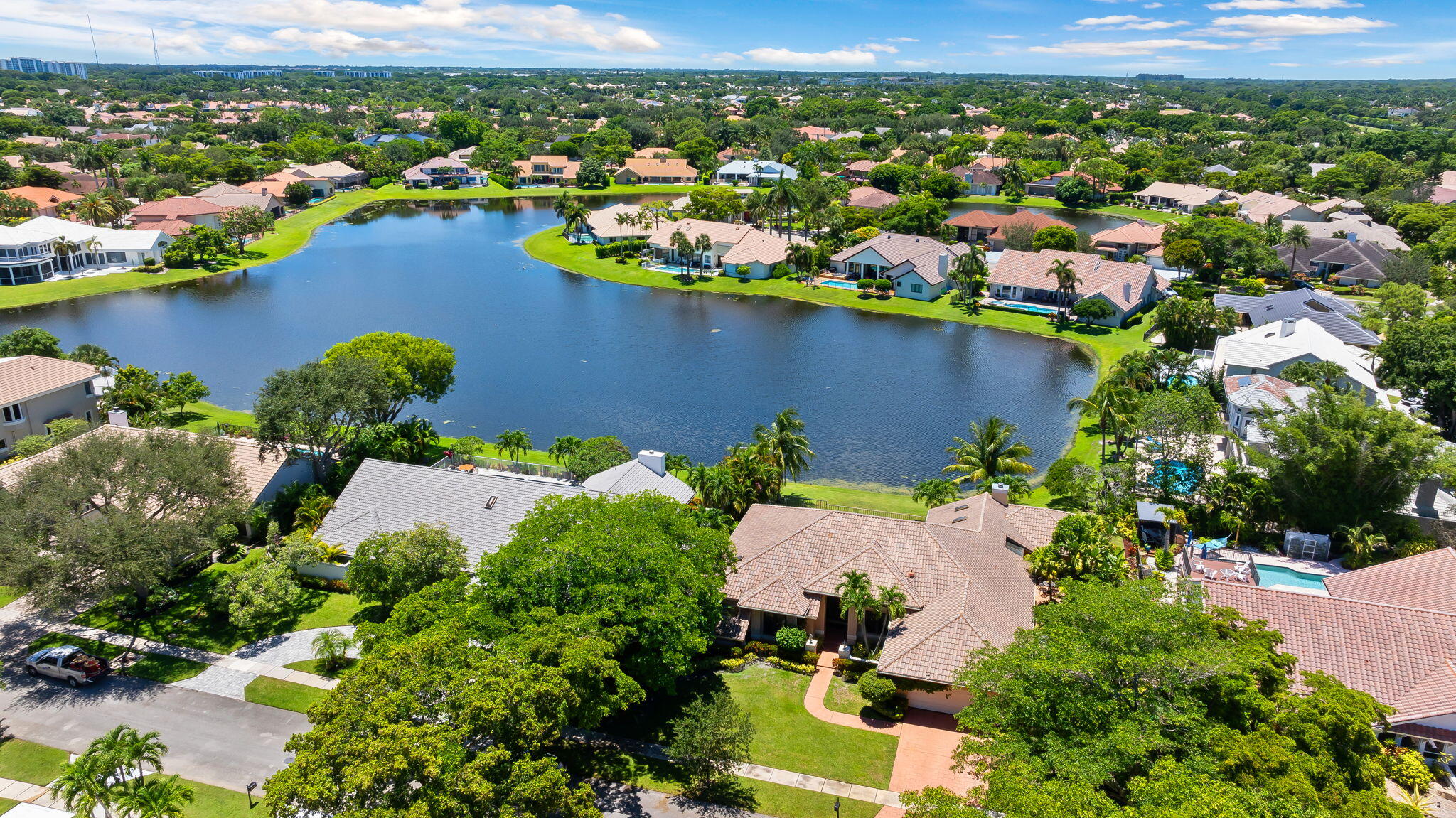 4885 Regency Court Boca Raton, FL 33434 - Photo 33 of 38 an aerial view of a houses with a lake