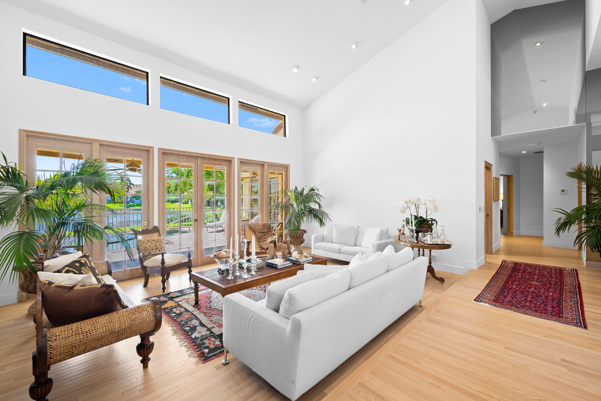 4885 Regency Court Boca Raton, FL 33434 - Photo 5 of 38 a living room with furniture and a large window