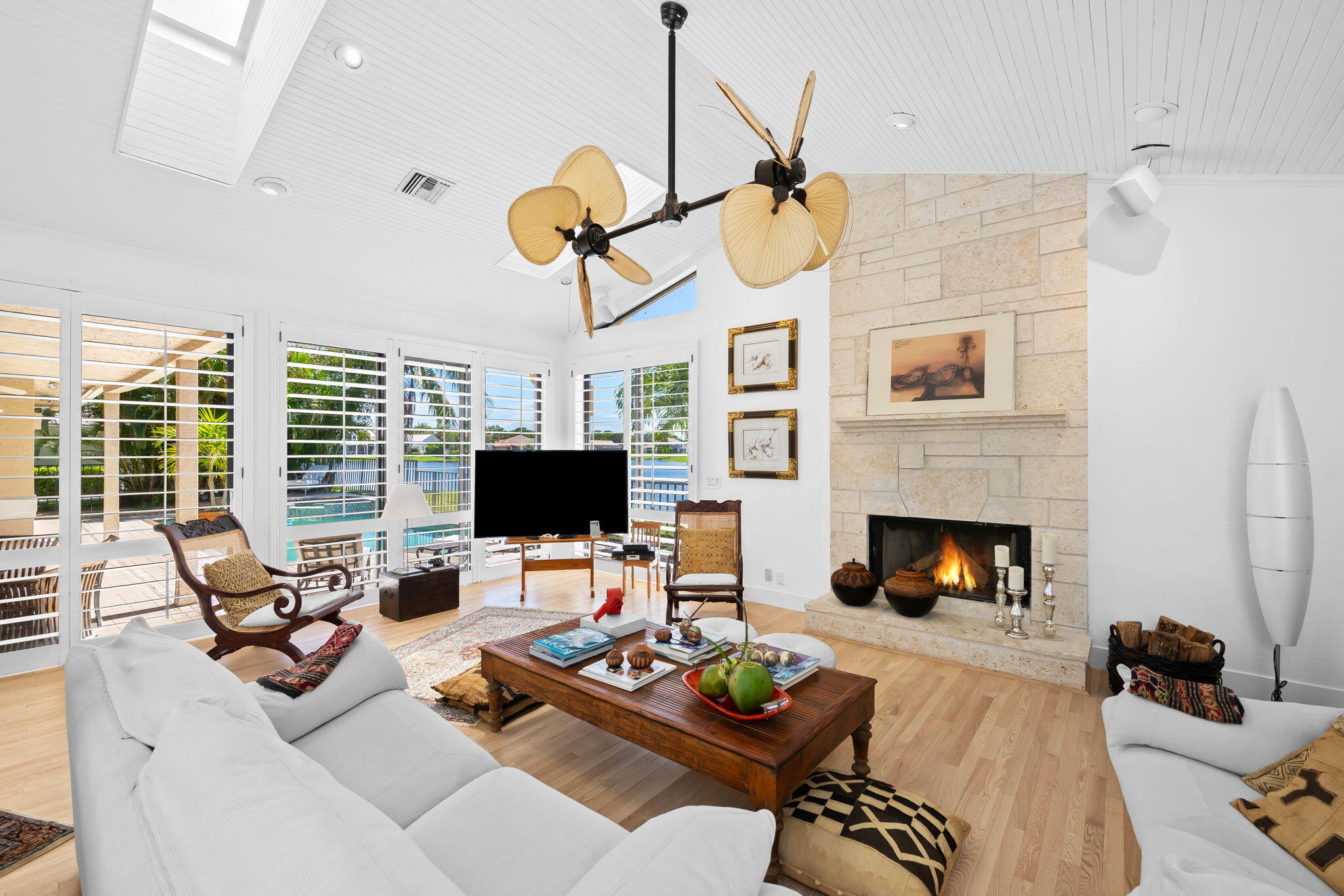 4885 Regency Court Boca Raton, FL 33434 - Photo 9 of 38 a living room with furniture fireplace and window