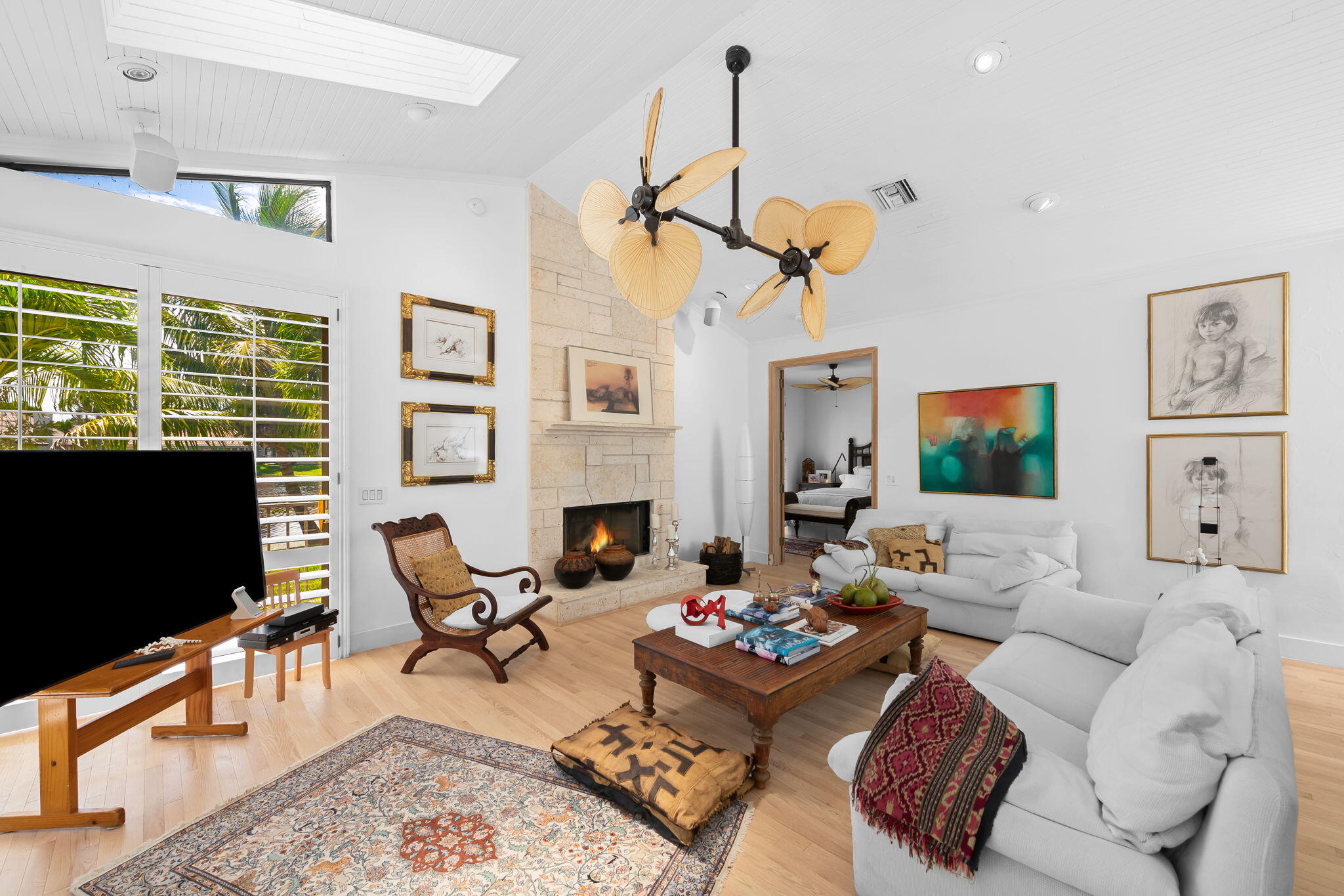 4885 Regency Court Boca Raton, FL 33434 - Photo 10 of 38 a living room with furniture a rug and a flat screen tv