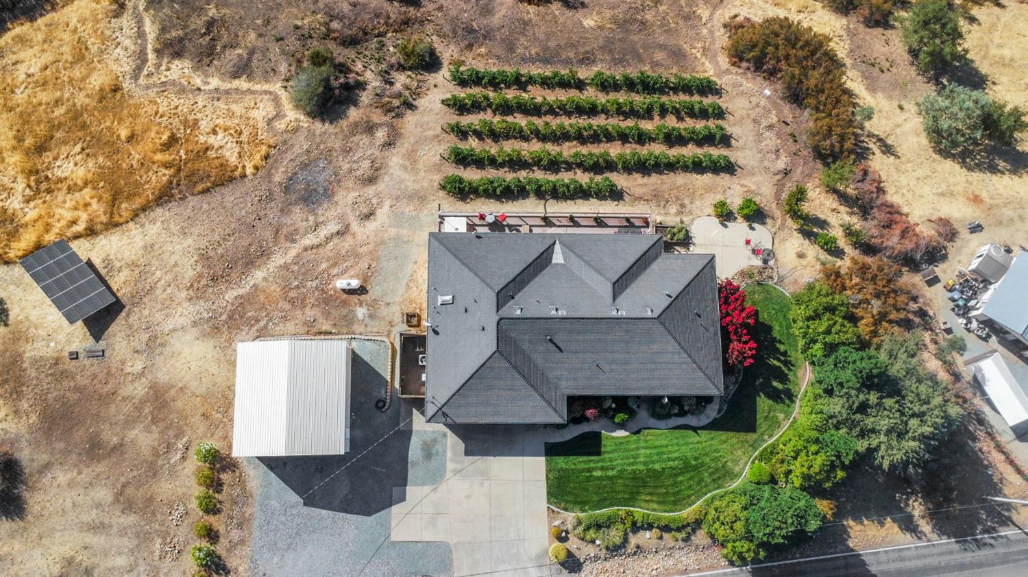 3235 Hagen Road Valley Springs, CA 95252 - Photo 5 of 40 an aerial view of a house with a yard wooden table and chairs