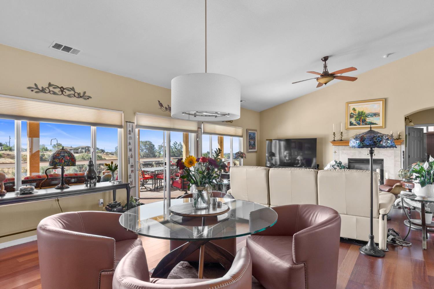 3235 Hagen Road Valley Springs, CA 95252 - Photo 10 of 40 a living room with furniture a flat screen tv and a large window