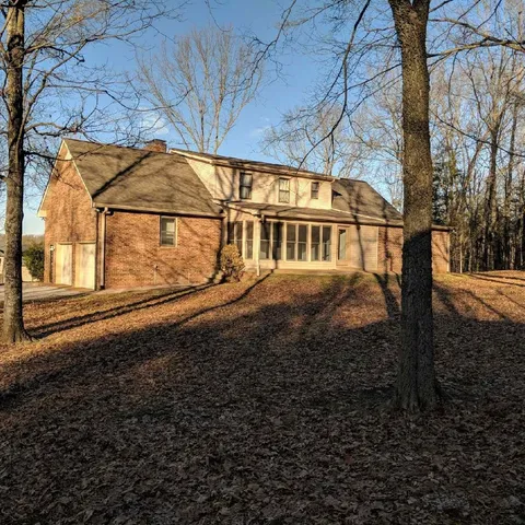 a view of a large house with a yard