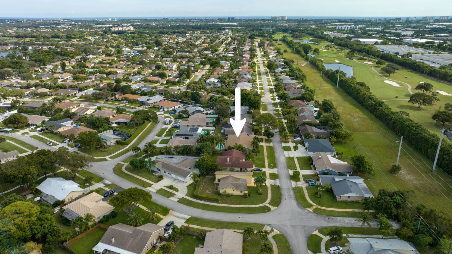 4695 Brandywine Drive Boca Raton, FL 33487 - Photo 27 of 28 an aerial view of residential houses with outdoor space
