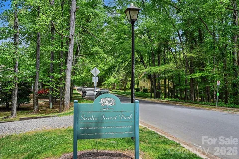 a view of a park with large trees