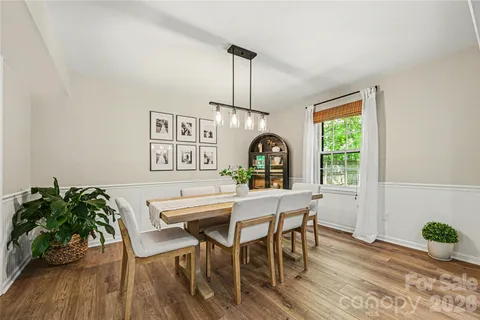 a view of a dining room with furniture and window