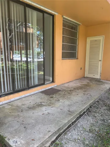 a view of backyard with porch