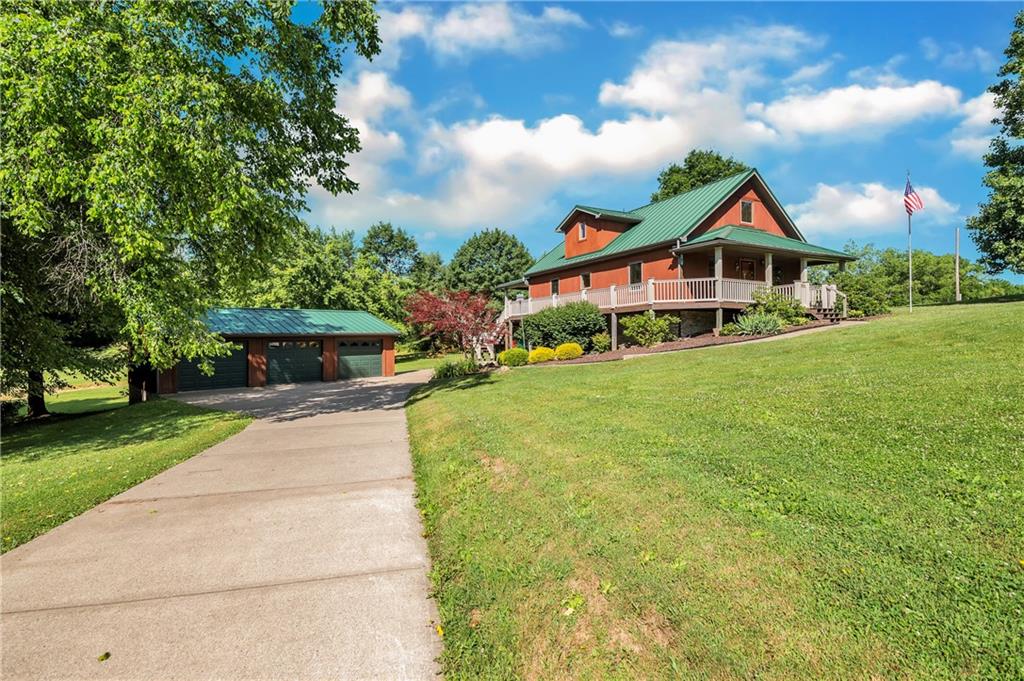 487 Ridge Road Hickory, PA 15340 - Photo 1 of 25 a front view of a house with garden