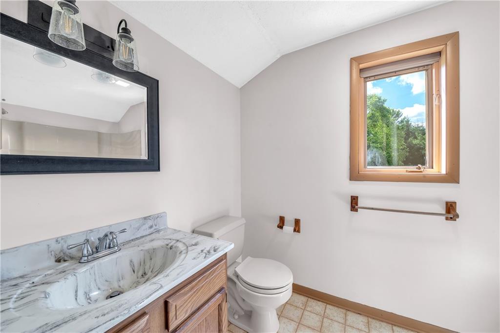 487 Ridge Road Hickory, PA 15340 - Photo 13 of 25 a white toilet sitting next to a bathroom sink