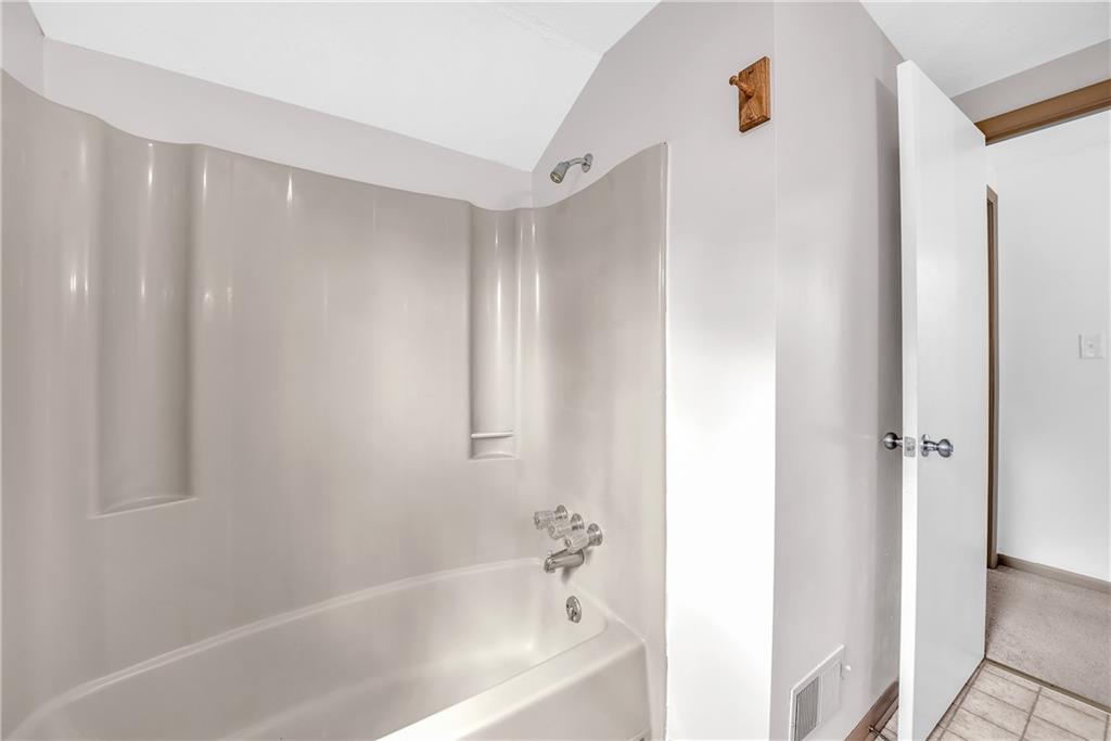 487 Ridge Road Hickory, PA 15340 - Photo 14 of 25 a bathroom with a bathtub and a shower