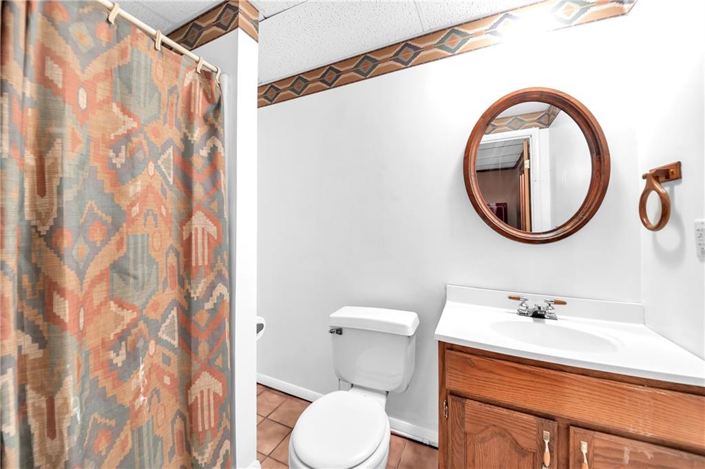 487 Ridge Road Hickory, PA 15340 - Photo 19 of 25 a bathroom with a toilet sink and mirror