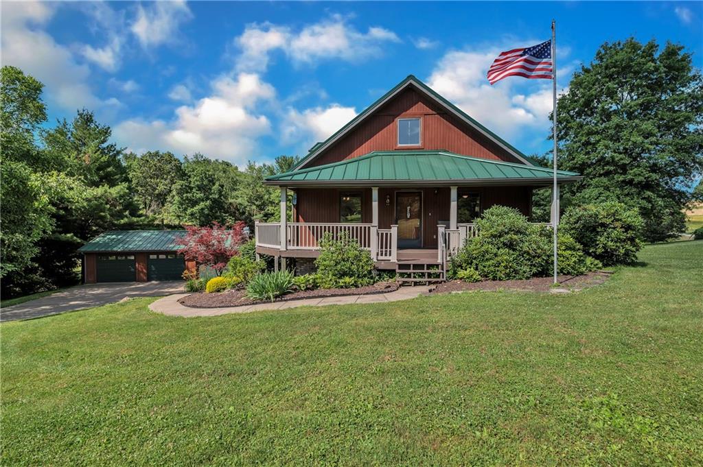 487 Ridge Road Hickory, PA 15340 - Photo 2 of 25 a front view of a house with swing and porch