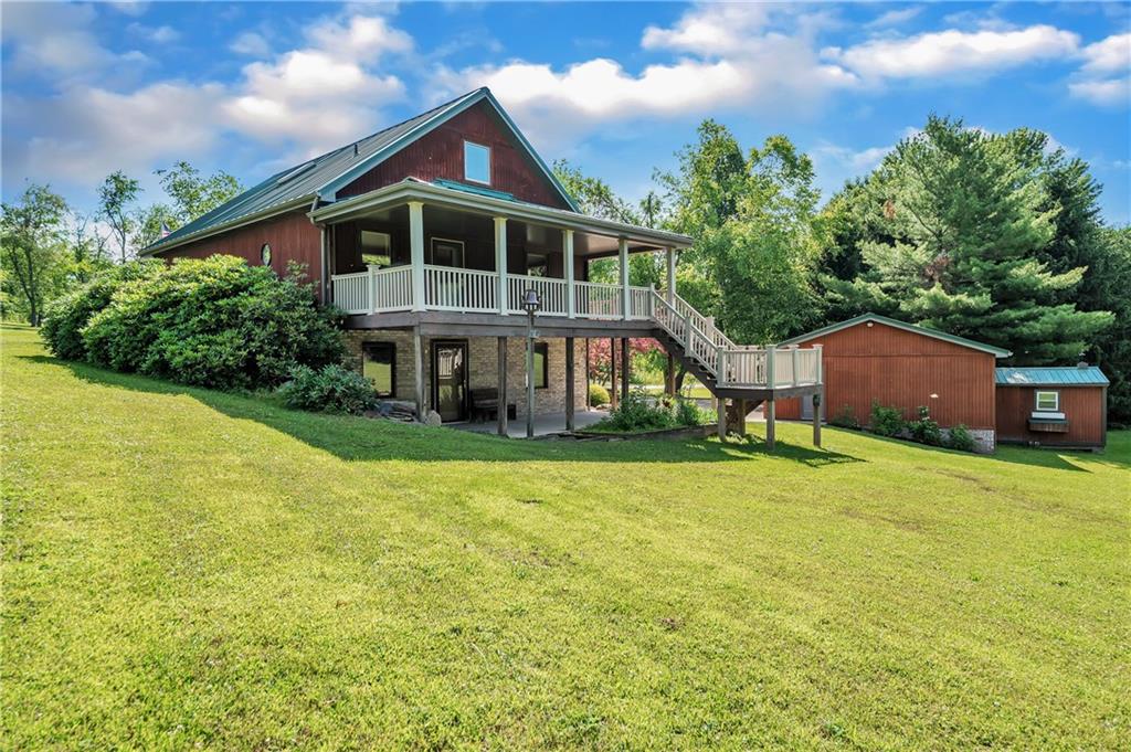487 Ridge Road Hickory, PA 15340 - Photo 21 of 25 a front view of house with yard and trees in the background