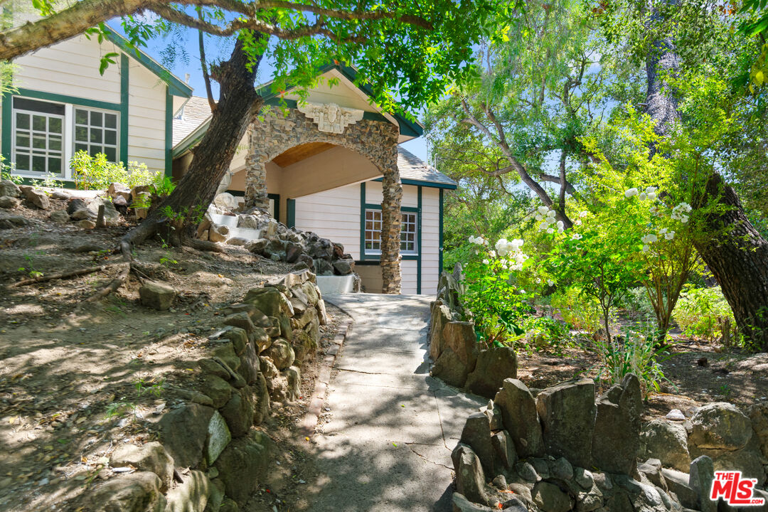 20912 Fontaine Road Topanga, CA 90290 - Photo 3 of 52 a front view of a house with a yard