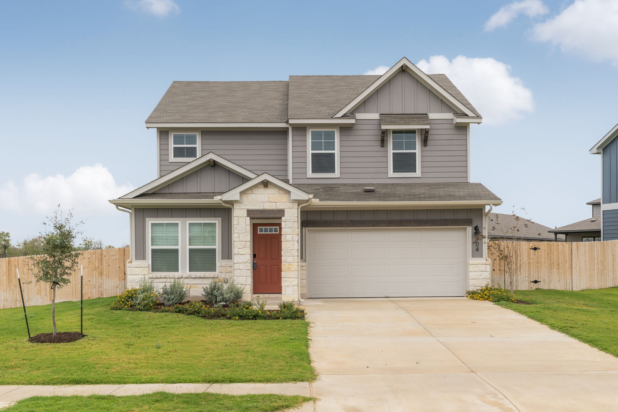 104 Boondoggle Ridge Cedar Creek, TX 78612 - Photo 6 of 33 a front view of a house with a yard