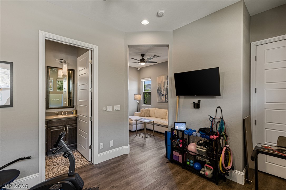 10118 Copper Edge Road Las Vegas, NV 89148 - Photo 23 of 48 Functional layout connecting a well-appointed bathroom and a bright living area.