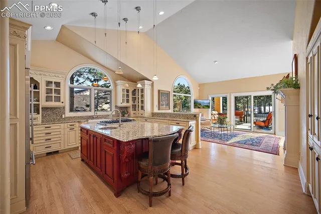 a kitchen with stainless steel appliances granite countertop a stove and cabinets