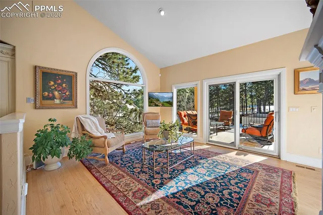 a bed sitting in a room next to a window