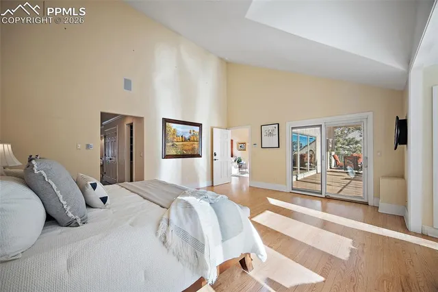 a bedroom with a large bed and a view of bedroom