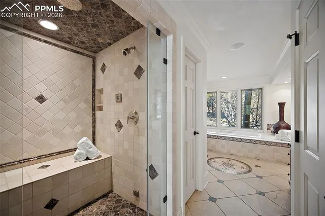 a bathroom with a bathtub and shower