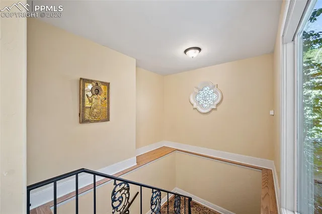 a view of a hallway with a window