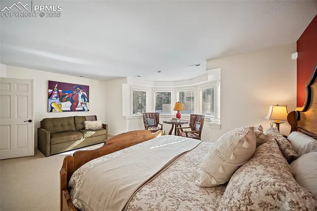 a bed room with a bed and a furniture