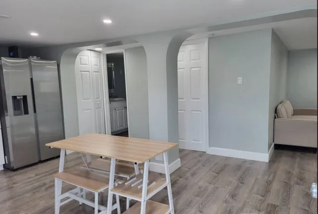 a kitchen with stainless steel appliances refrigerator microwave and stove