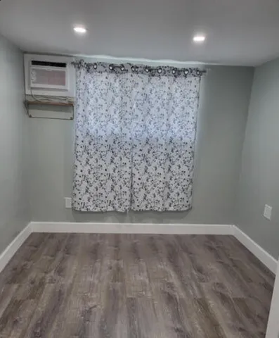 a view of a livingroom with wooden floor