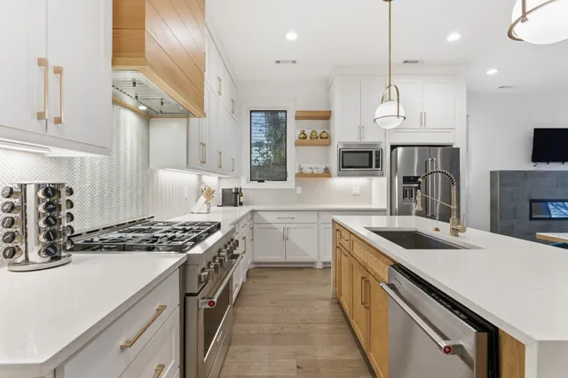 a kitchen with a sink stove and refrigerator