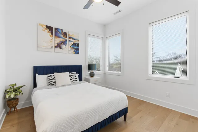 a bedroom with a large bed and a window