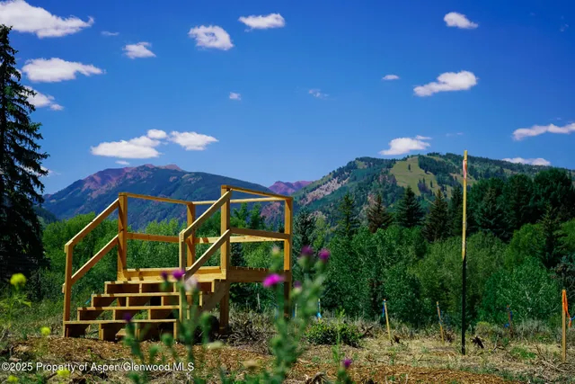 a garden view with a seating space